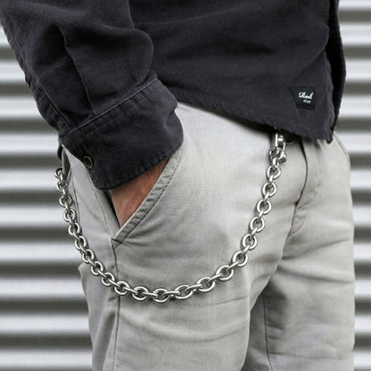 Men’s stainless steel wallet chain worn with light jeans, featuring solid anchor links and rugged heritage style.